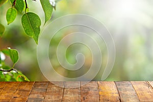 Wooden board empty table in front of blurred natural background. Perspective Old wood over blur in natural