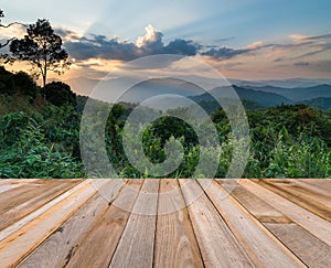 Wooden board empty table in front of sunset mountain landscape b