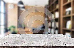 Wooden board empty Table Top And Blur Interior over blur in coffee shop Background, Mock up for display of product