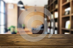 Wooden board empty Table Top And Blur Interior over blur in coffee shop Background, Mock up for display of product