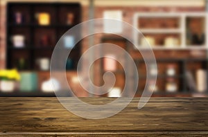 Wooden board empty Table Top And Blur Interior over blur in coffee shop Background, Mock up for display of product