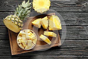 Wooden board with fresh sliced pineapple