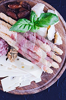 Wooden board with appetizers