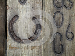 Wooden board with horseshoe branded