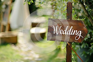 Wooden board with the inscription in paint Wedding. Sign for guests at the entrance, outdoors wedding ceremony decoration. Hand