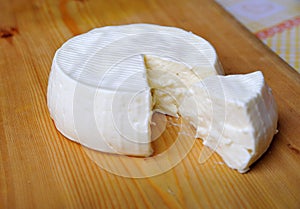Wooden board with italian cheese