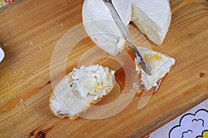 Wooden board with italian cheese and honey