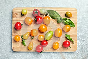 Wooden board with juicy tomatoe