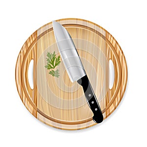 Wooden board with knife and parsley