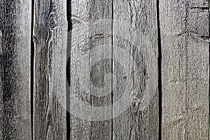 Wooden board made of gray planks. Texture vertically.