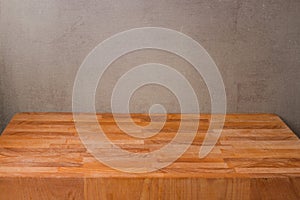 Wooden board over rustic wall background for product montage