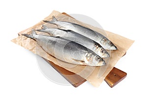 Wooden board with salted herrings isolated on white