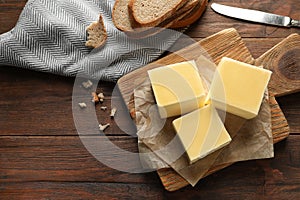 Wooden board with tasty fresh butter on table