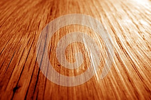 Wooden board texture with blur effect in orange tone