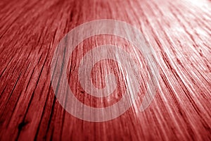 Wooden board texture with blur effect in red tone