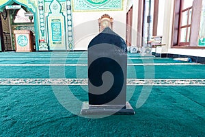 A wooden board to divide people praying in the mosque
