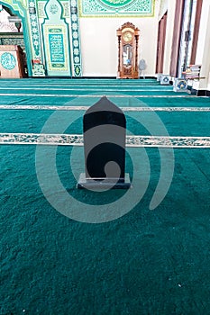 A wooden board to divide people praying in the mosque