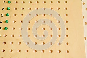 Wooden board to learn to count numbers and do mathematical operations