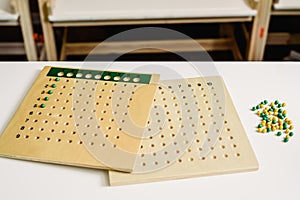 Wooden board to learn to count numbers and do mathematical operations