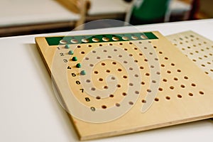 Wooden board to learn to count numbers and do mathematical operations