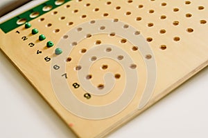 Wooden board to learn to count numbers and do mathematical operations
