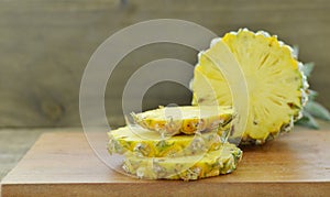 Wooden board wth Fresh slices pineapple