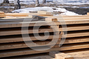Wooden boards on a construction site in the spring forest, closeup.