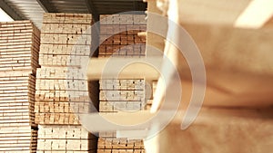 Wooden boards stacked in warehouse after the process of woodworking