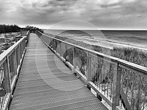 Wooden boardwalk along Baltic seaside in Darlowko Poland