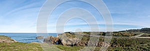 Wooden boardwalk and coast at the Playa de las Catedrales national monument in Galicia photo