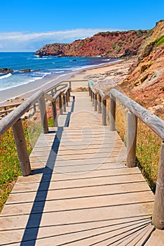 Wooden boardwalk downstairs to amado beach, portugal