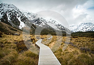 The wooden boardwalk in Hooker valley leading the path to Mount Cook 3,764 metres the highest mountains in South Island of New Z