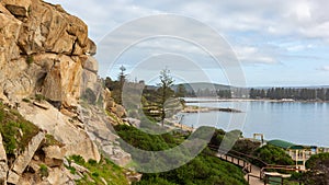 The wooden boardwalk and iconic rock formations on Granite Island looking back to  Victor Harbor South Australia on August 3 2020