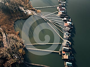 Wooden boardwalk on lake, drone shot.