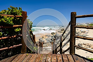 Wooden boardwalk leading to the beach in Keurboomstrand, South Africa