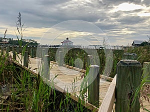 Wooden boardwalk leading to a lighthouse