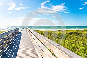 Wooden Boardwalk to Indian rocks beach in Florida, USA