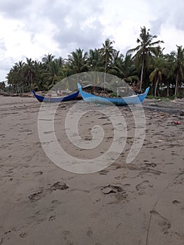 wooden boat on the beach waiting for the right moment to go out to sea