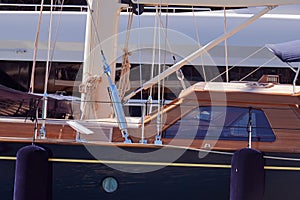 Wooden boat docked in the marina photo