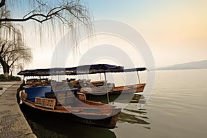 Wooden boat is docked at the shore