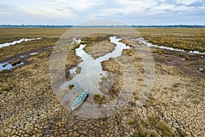 Wooden boat on drought land