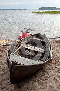 Wooden boat and hydrocycle.