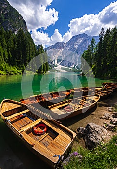 Wooden boat at lake Braies, Dolomites mountains, Italy