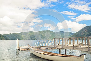 Wooden boat pier on mountain lake