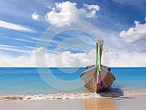 Wooden boat on pristine beach, nature background