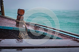 Wooden boat in the rain, Thailand