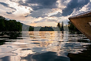 Wooden boat on Rhine river at sunset