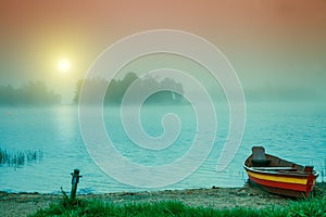 Wooden boat on the river bank