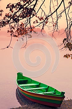 Wooden boat on the river bank