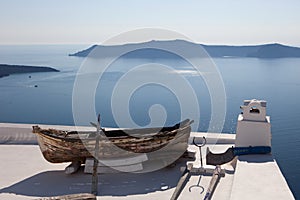 Wooden boat on the roof of the building. Thira Fira